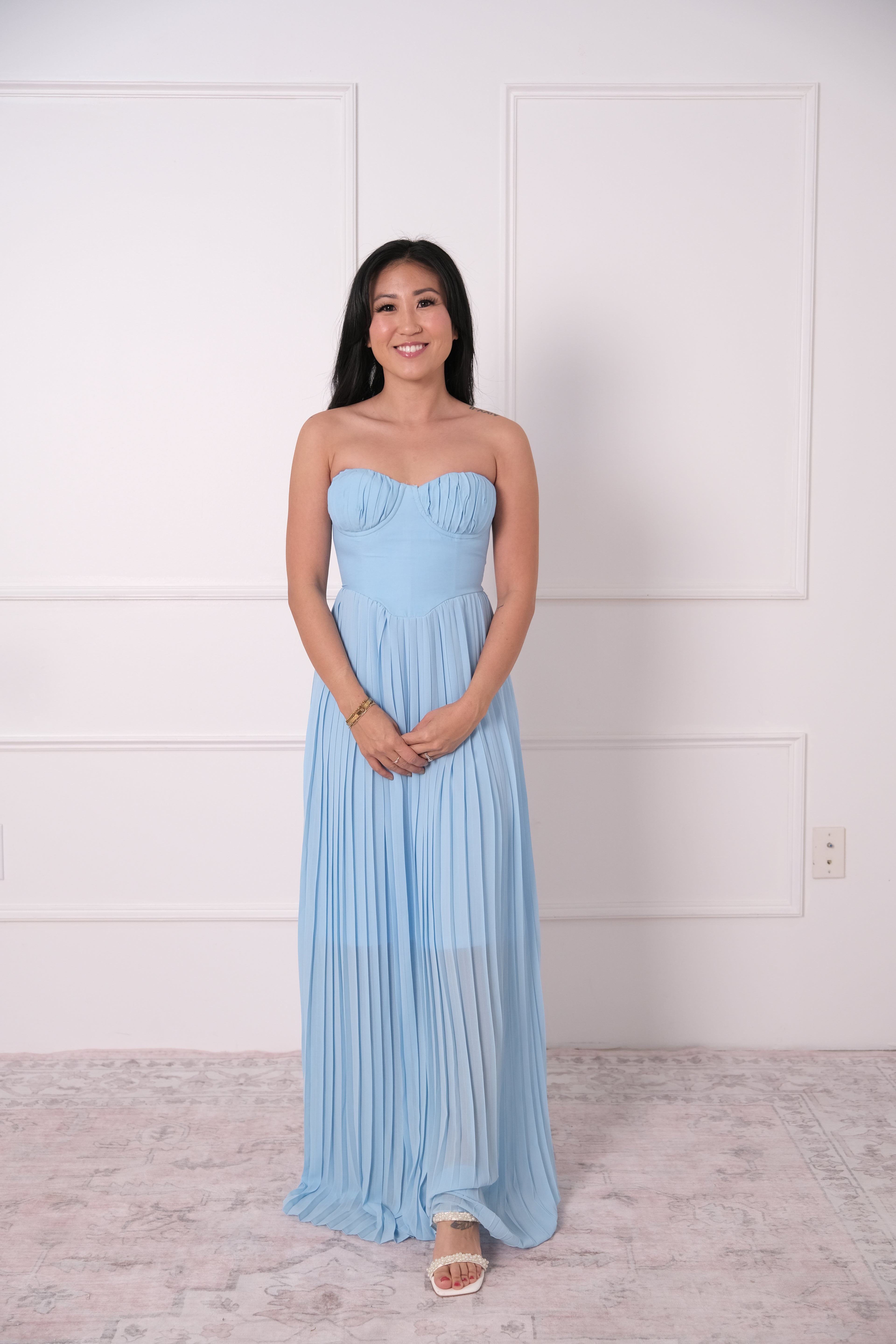 The Blue Pleated Strapless Gown