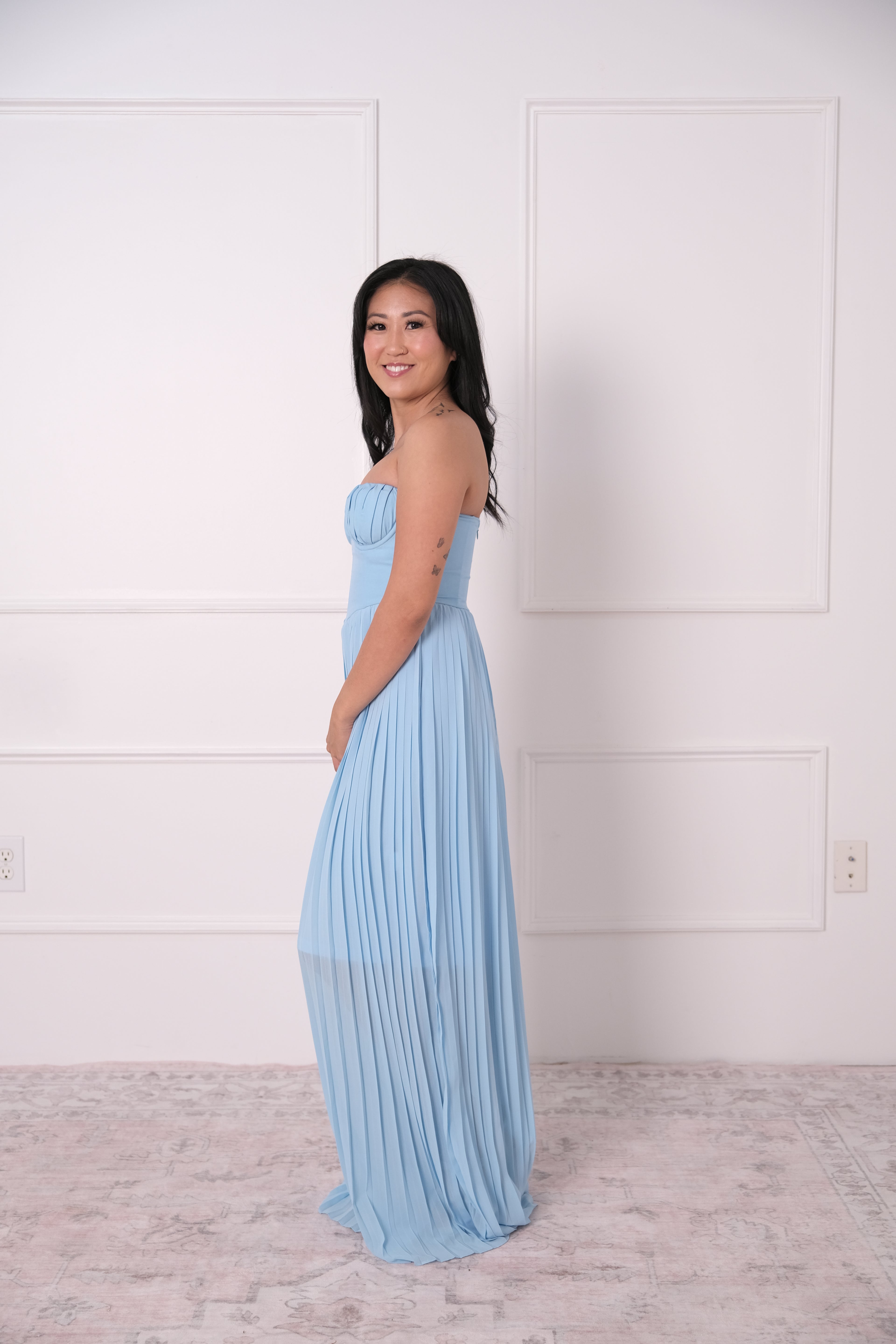 The Blue Pleated Strapless Gown